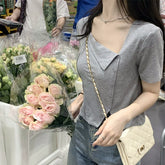 Commuting style spicy girl slanted neck short sleeved T-shirt for women, American style slim fit and slimming button design, niche short top for women's clothing