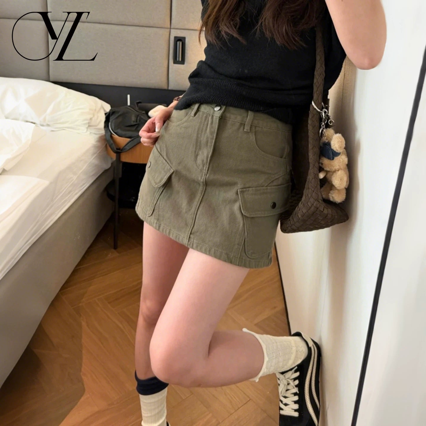 Military green workwear denim skirt and pants for women in the summer of 2026, featuring a slimming design with multiple pockets and anti glare A-line skirt