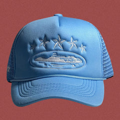 Corteiz Vintage Light Blue Trucker Hat with White Stars and Cruise Ship Graphic